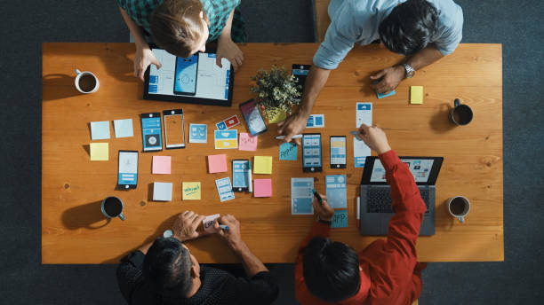 istock Top view of developer and designer shake hand together at meeting. Convocation. 2159590999