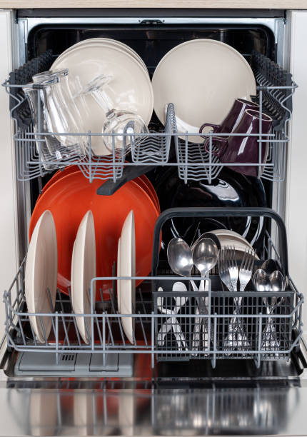 istock Modern dishwasher built into the kitchen unit for washing dishes 2159593407