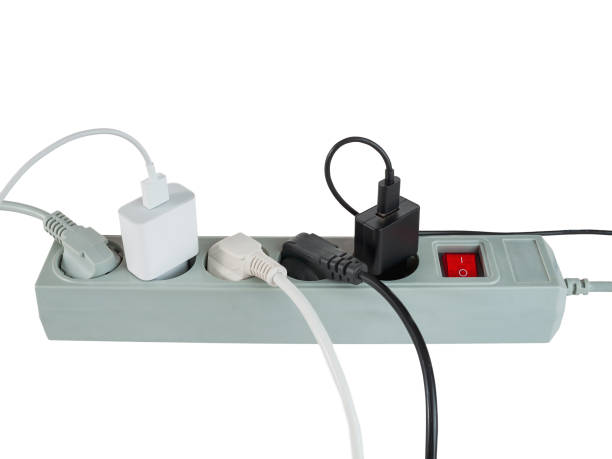 istock Various electrical plugs from electrical appliances connected to an extension cord isolated on a white background 2159593840