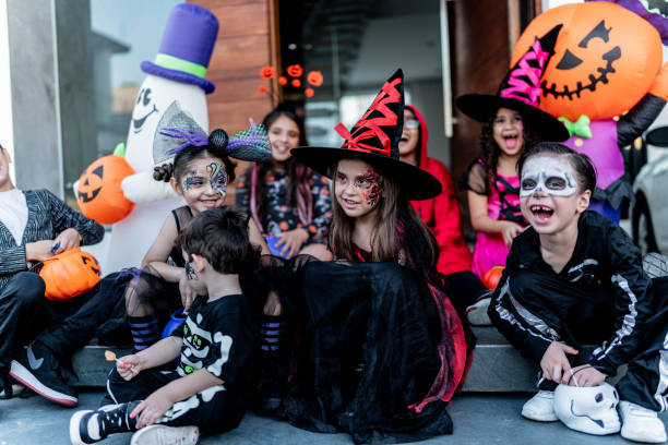 istock Children talking using Halloween costume outdoors 2159594108