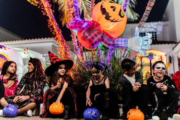 istock Children talking after picking up candy on Halloween 2159594311