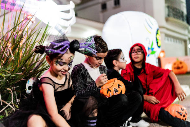 istock Children talking after picking up candy on Halloween 2159594336