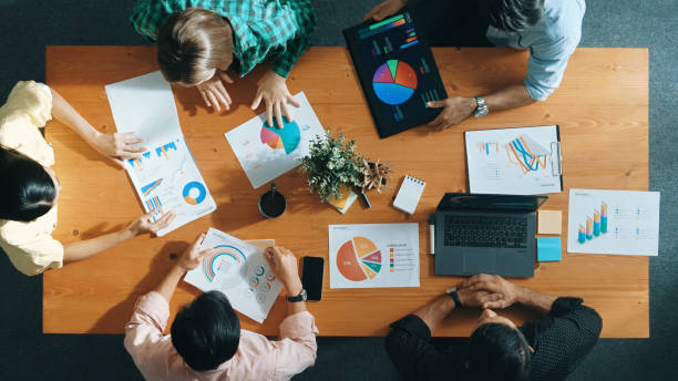 istock Top view of manager use tablet to analyze data and financial chart. Convocation. 2159594558