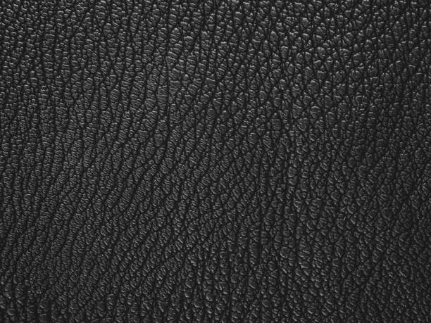 istock Texture of black leather clothing fabric selective focus 2159594838