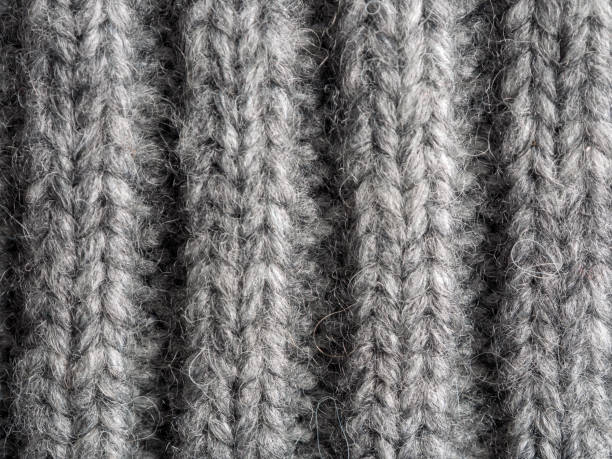 istock Surface of wool fabric material Knitted woven selective focus 2159594861