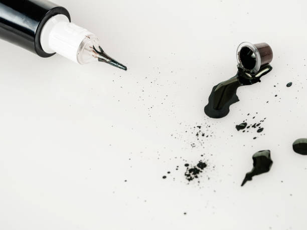 istock Tattoo machine for tattooing , permanent makeup, with jars of paint, close-up needle, selective focus 2159595268