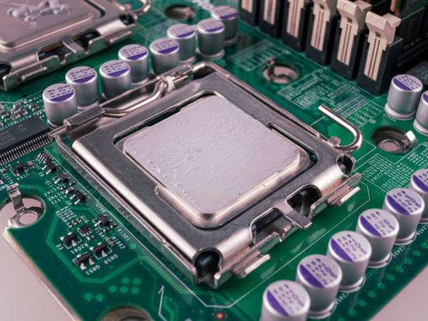 istock Correct application of thermal conductive paste to the cover of a computer or server circuit before installing the radiator of the cooling system, close 2159596098