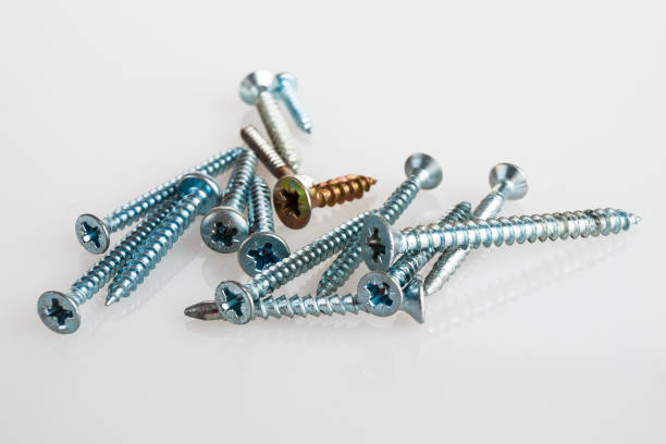 Bolts screws self-tapping screws of various shapes and sizes for connecting fastener elements isolated on a white background close-up