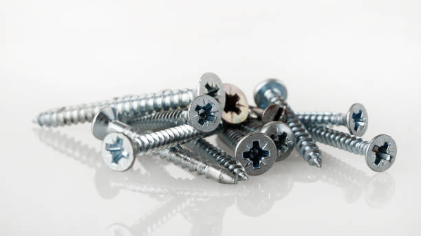 istock Bolts screws self-tapping screws of various shapes and sizes for connecting fastener elements isolated on a white background 2159596179
