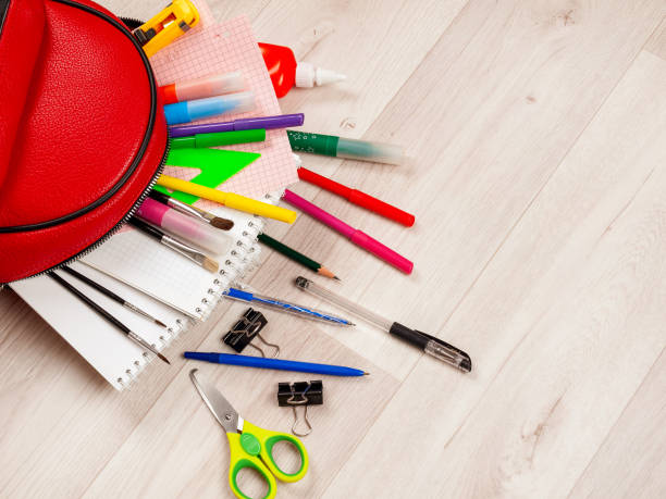 istock Stationery for studying against the background of a student's backpack 2159596257