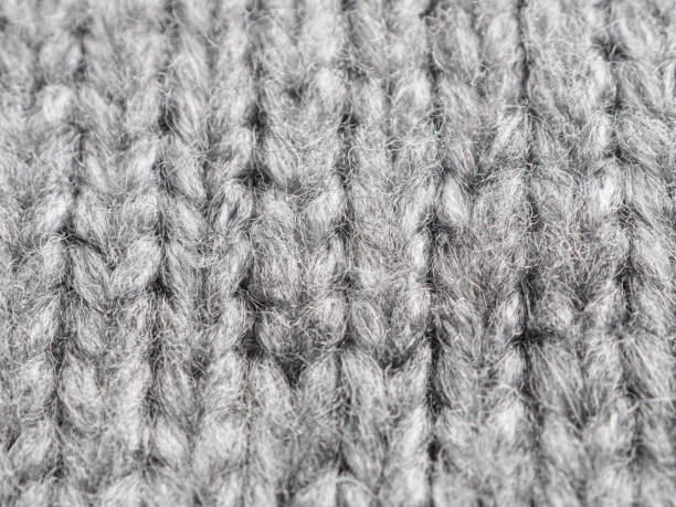 istock coarse knitted wool fabric, fabric background, close-up 2159597130