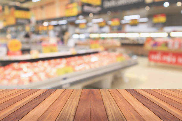 istock Empty wood table top with supermarket blurred background for product display 2159600967