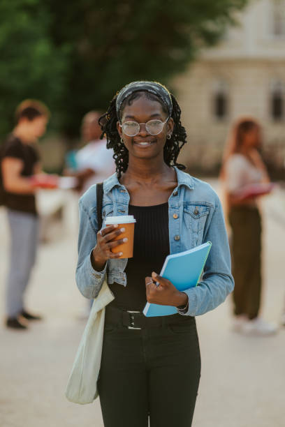 istock Young diverse happy student at college campus smiling at camera. 2159601242