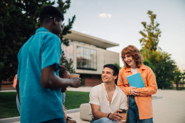 istock Happy interracial college students having coffee break at campus. 2159601254