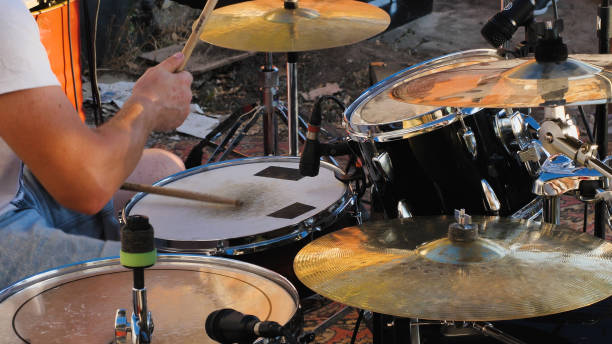 istock A passionate drummer immersed in the rhythm, skillfully playing the drum set 2159601541