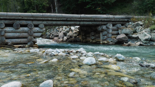istock A beautiful mountain river and a wooden bridge 2159601658
