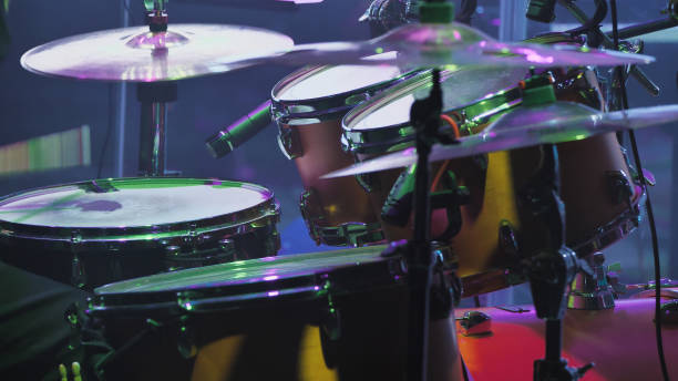istock A professional drum kit captured from an angle showcasing three tom-toms with worn-out batter-heads and two cymbals 2159602974
