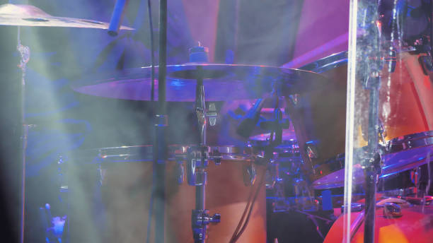 istock Close-up of a drum kit with various elements: cymbals, drum and drumsticks 2159602979