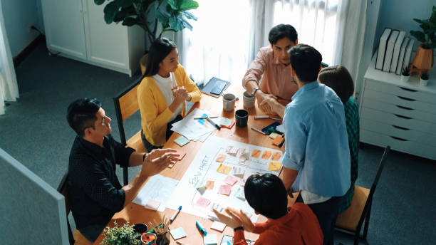 istock Top view of diverse people brainstorming and making task board. Convocation. 2159604125