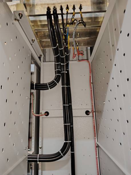 istock Image of electric wires connected to common copper bars in electrical cabinet. 2159605003