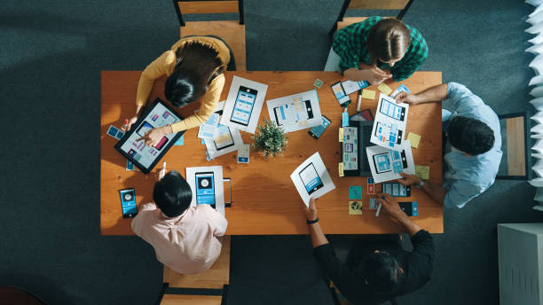 istock Top view of developer and designer shake hand together at meeting. Convocation. 2159607113