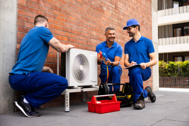 istock Skilled HVAC technician installs air conditioner for commercial building 2159608125
