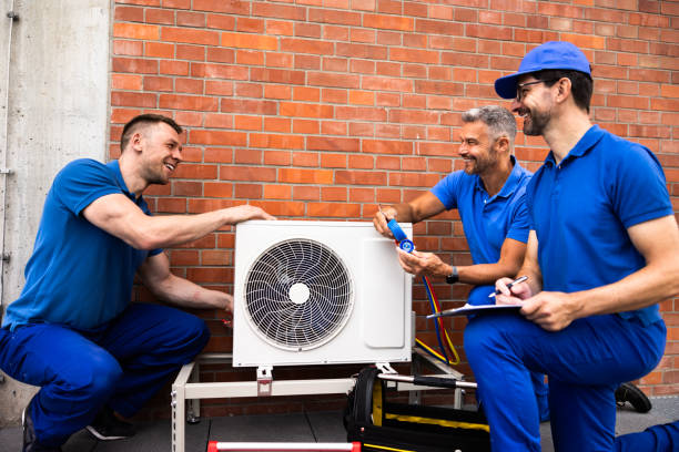 istock Skilled HVAC technician installing air conditioner unit for commercial building 2159608132