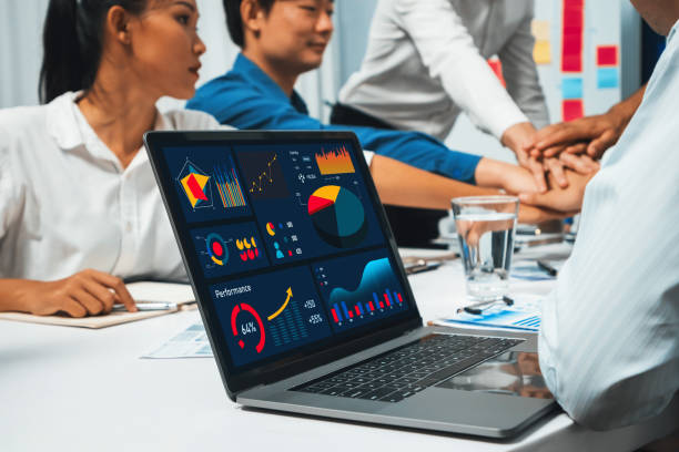 istock Bi dashboard display on laptop monitor with teamwork background. Prudent 2159611389