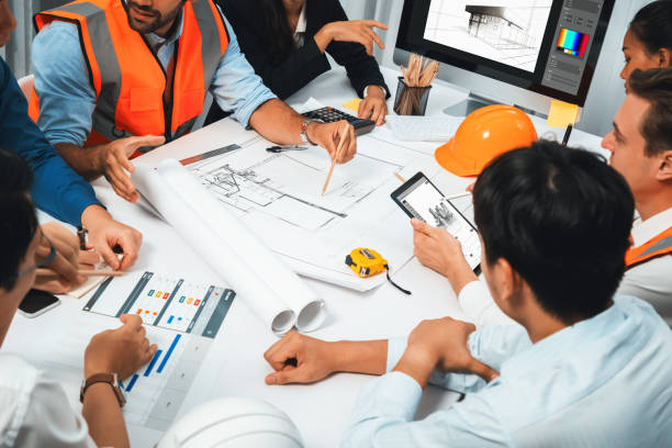 istock Diverse group of civil engineer and client working on architect. Prudent 2159611404