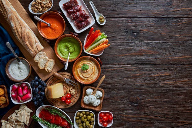 istock Table top view of antipasto assortment on rustic wooden board. 2159612369