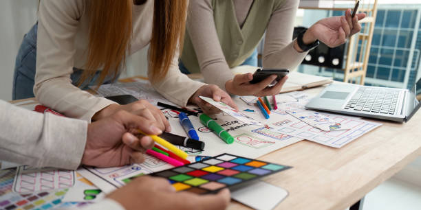istock Creative UX Developer and UI Designer Brainstorming Session with Color Palettes and Wireframes 2159612467