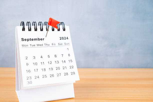 istock September 2024 calendar and red push pin on the table. 2159614568