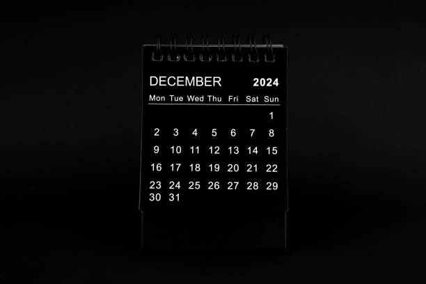 Black Calendar for December 2024. Desktop calendar on a black background.