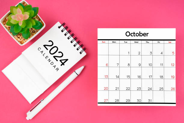 istock White calendar for October 2024 and pen on pink color background. 2159614601