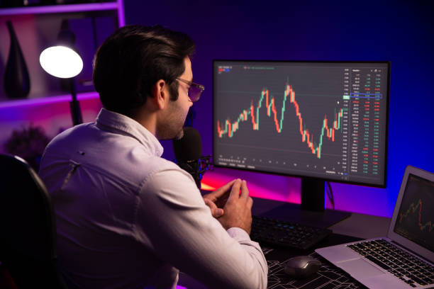 istock Smart trader concentrating on dynamic stock exchange on pc and laptop. Surmise. 2159615299