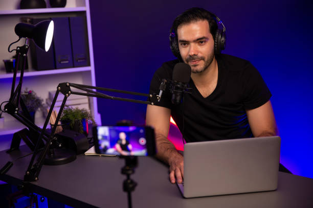istock Broadcaster talking to listener on live streaming, recording phone. Surmise. 2159616910
