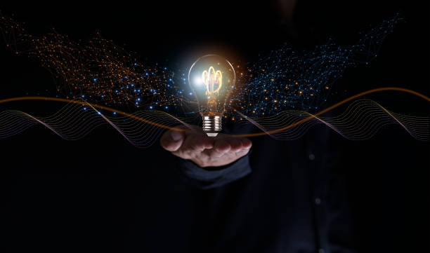 istock Solution or creative idea for designing a web banner or landing page for an innovative company with a hand sticking out of the screen with a light bulb. Famous abstract geometric shapes and lead lines 2159619139