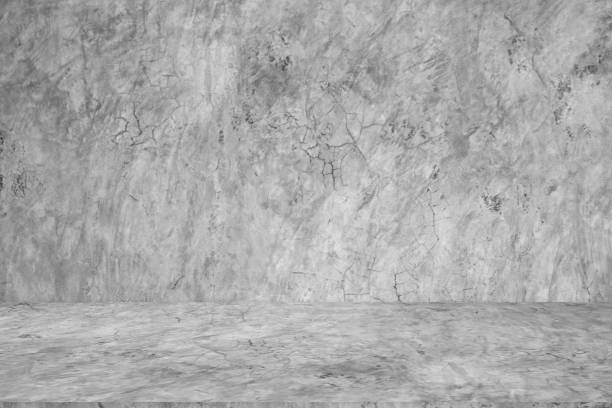 istock Wall empty studio interior background and backdrop of concrete cement wall in black and gray tones. Studio interior background and empty space Decorating ideas 2159620507