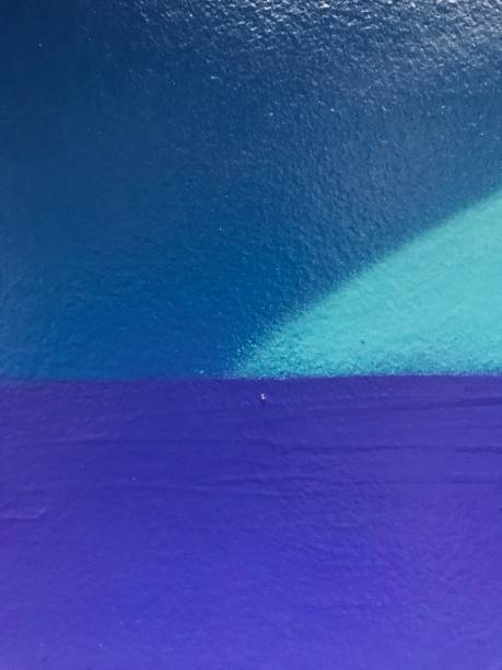 Colorful texture. Colorful wall. Blue tone background. Blue waves. Wall with blue paint. Blue background