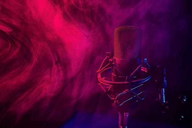 istock Professional microphone in red blue smoke on a black background. 2159621575