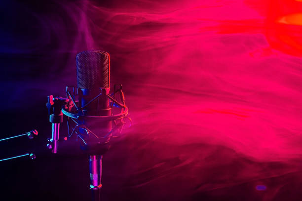 istock Professional microphone in red smoke on a black background. 2159621617