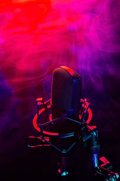 istock Professional microphone in red blue smoke on a black background. 2159621912
