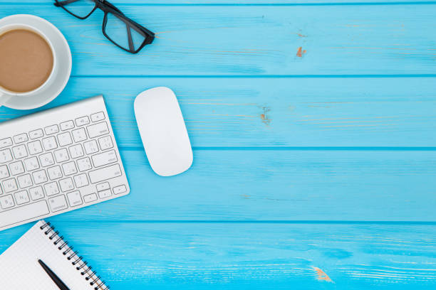 istock workspace with tablet, keyboard, coffee cup and eyeglasses copy space on  background. Top view. 2159622723
