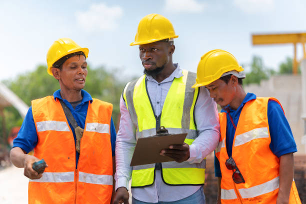 istock Engineer and foreman worker team inspect the construction site, Site manager and builder on construction site 2159624516