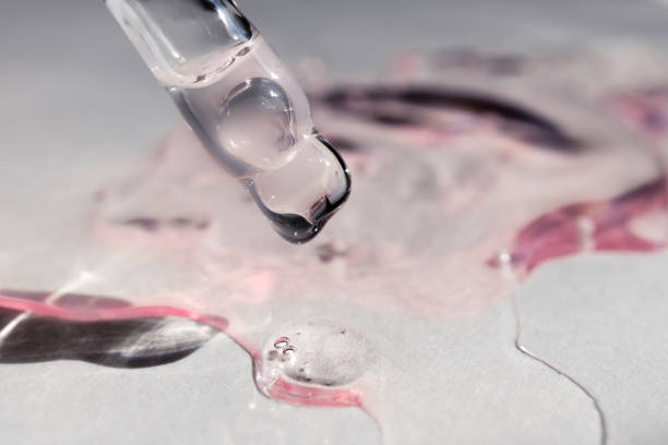 istock A drop of cosmetic aromatic oil drips from the pipette. Front view. 2159626269