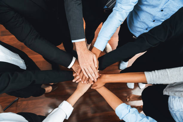 istock Multiracial business people make synergy hand stack together. Habiliment 2159627805