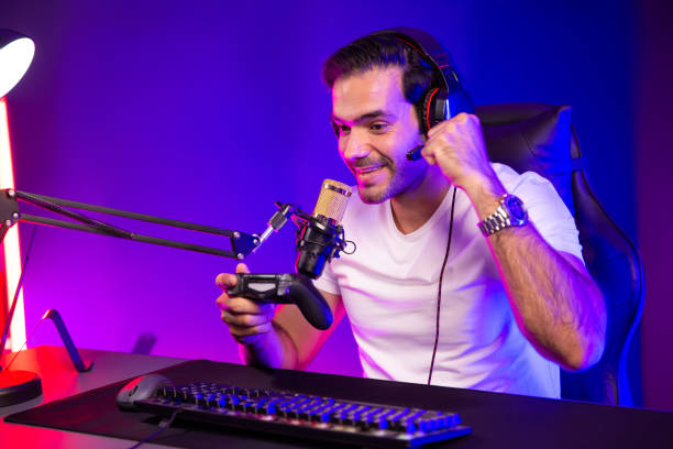 istock Streamer talking with team member players with joystick control game. Surmise. 2159628042