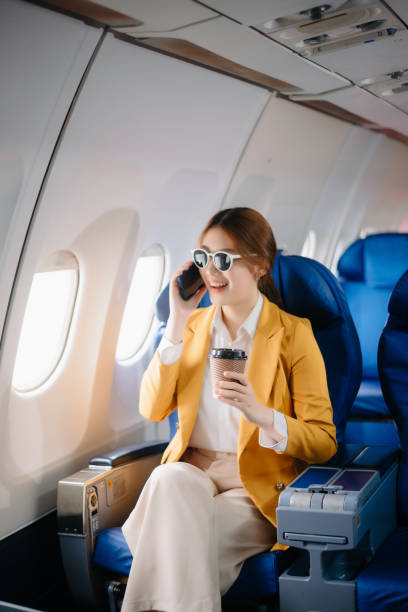 istock Asian Woman Working on Tablet During  in first class, multitasking with Flight Travel in style, work 2159628675