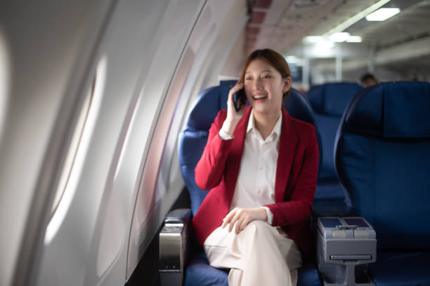 istock Asian Woman Working on Tablet During  in first class, multitasking with Flight Travel in style, work 2159628688