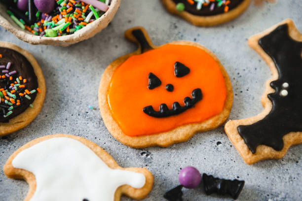 istock Halloween homemade gingerbread cookies with pumpkin shape 2159630057
